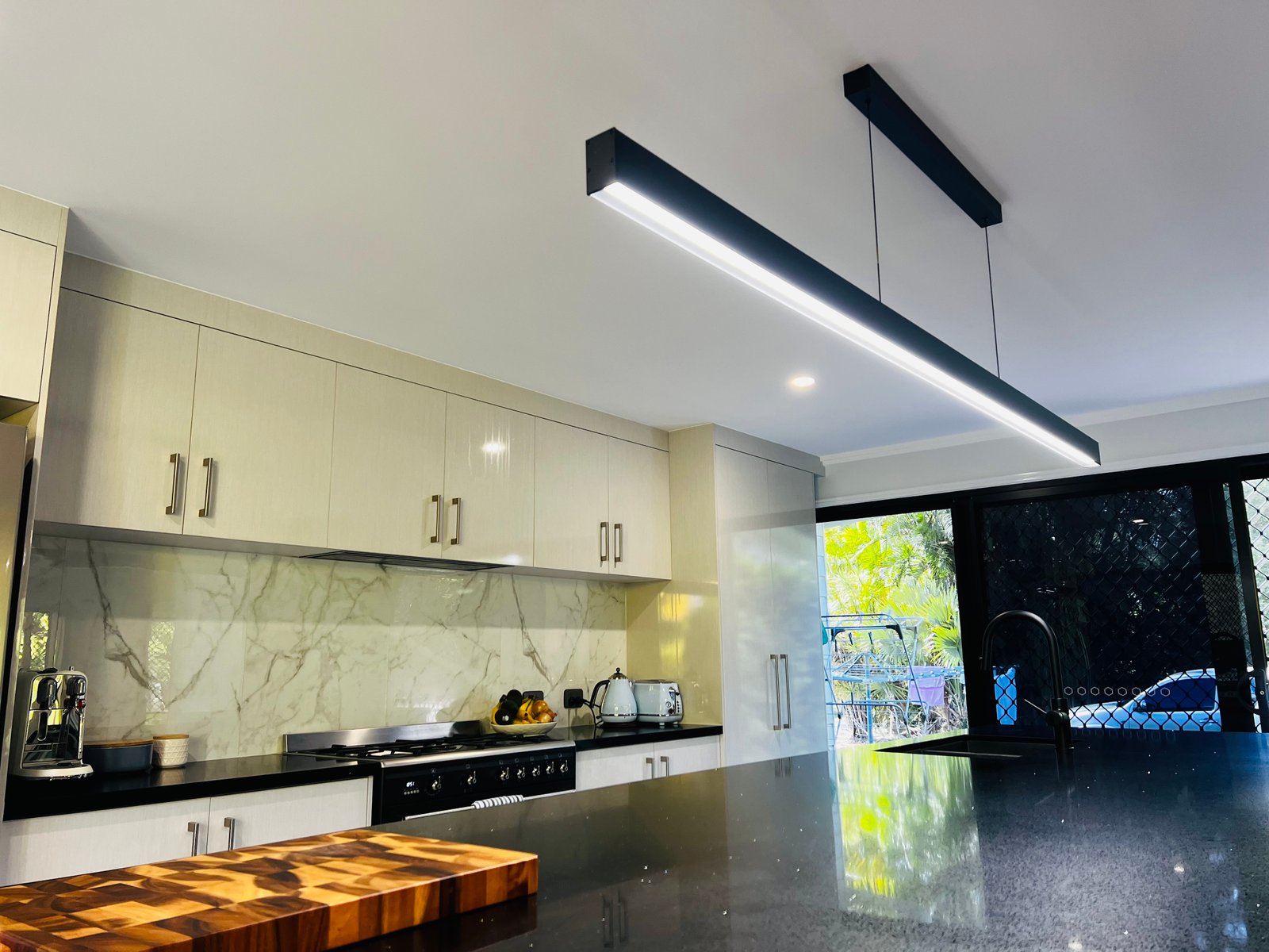 Modern linear kitchen pendant lighting installation
